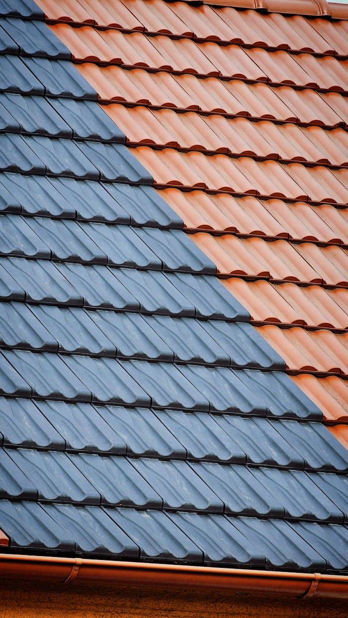 Close-up of roof tiles with striking blue and orange pattern.