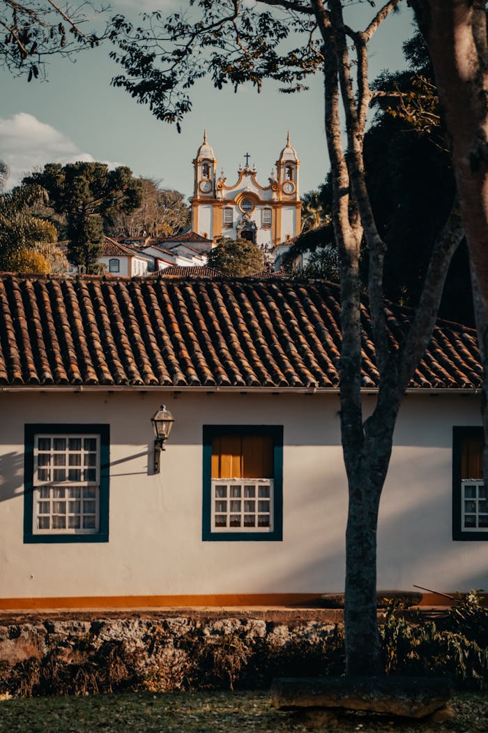 Charming colonial-style buildings with a view of the Church of Santo Antônio in Tiradentes, Brazil.